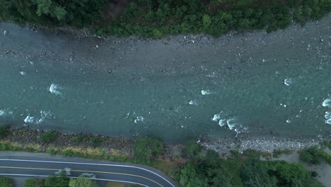 aerial view of river with rocky riverbed seen through clear water. - overhead shot
