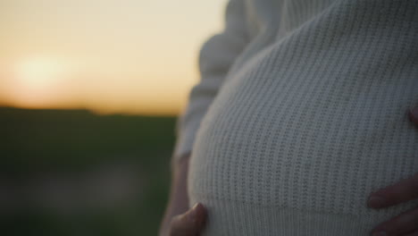 pregnant woman in sunset silhouette