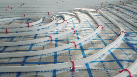 underfloor heating pipes are laid on a special surface installation of a heating system