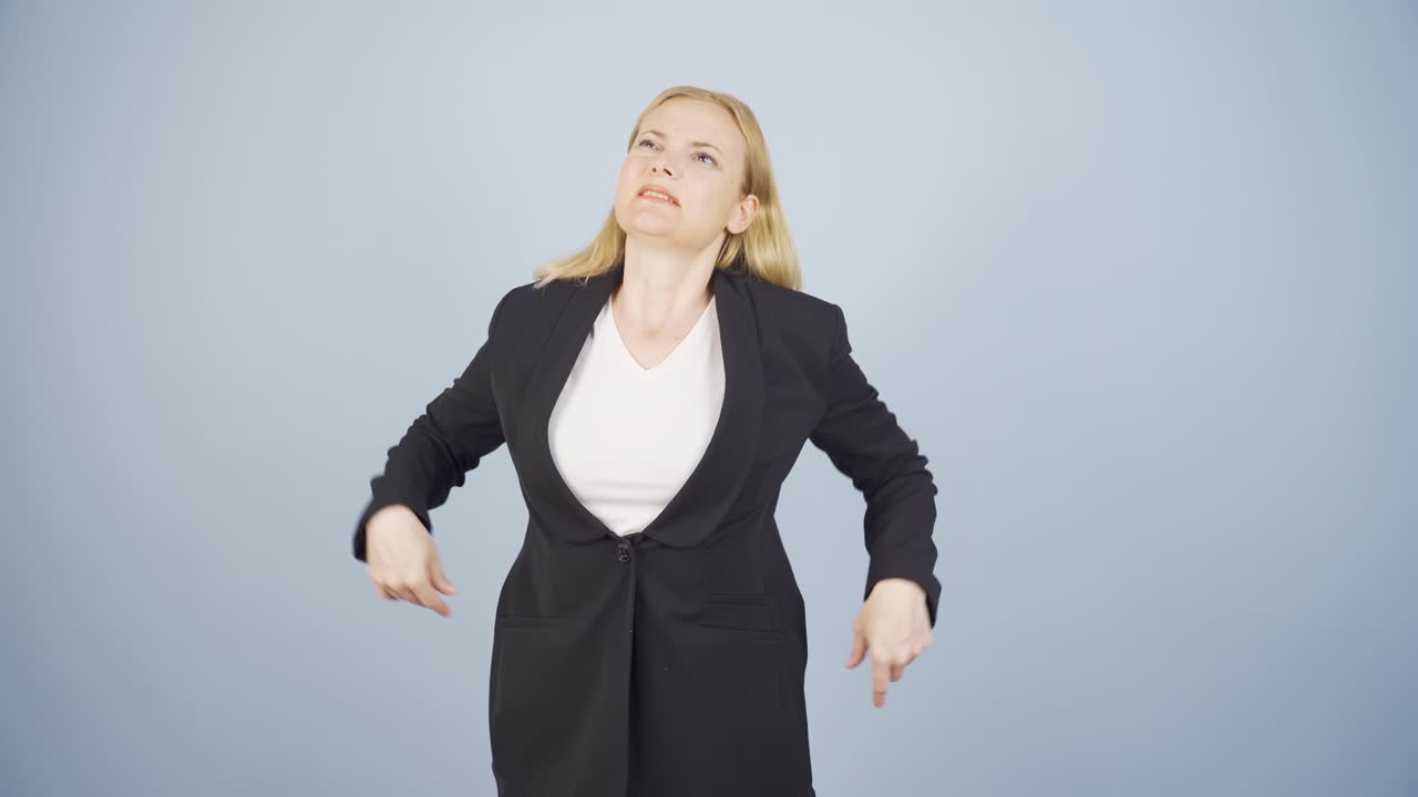 Business woman's shoulders hurt.