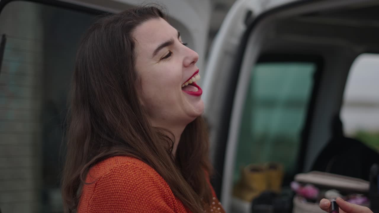 Woman laughing in a van