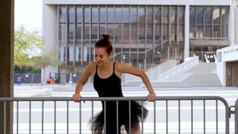 Ballet-dancer-dancing-by-railing-4k