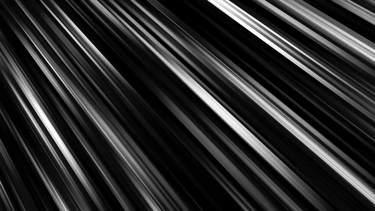Video astratto in bianco e nero di linee di velocità diagonali che si muovono rapidamente verso destra su sfondo nero.
