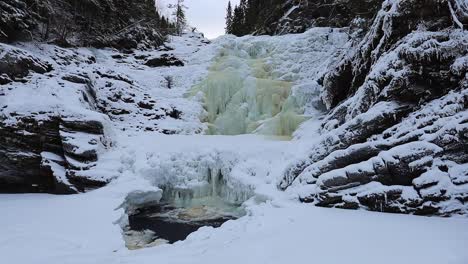 big and frozen waterfall dolanfossen on river homla in norway