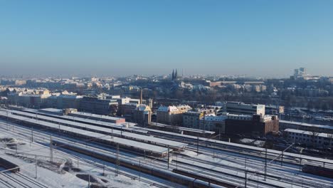 prague smichov railway station aerial drone winter view, upper castle and city in background, czech republic