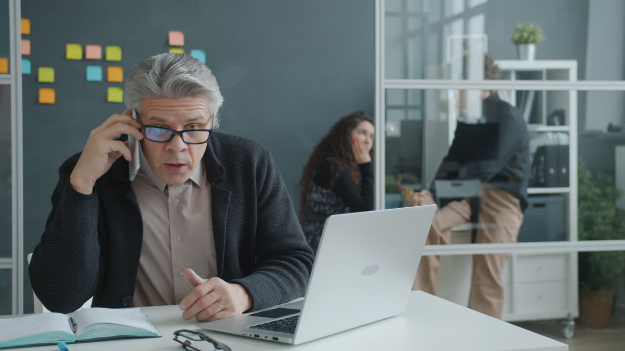 Angry Man on Phone in Office