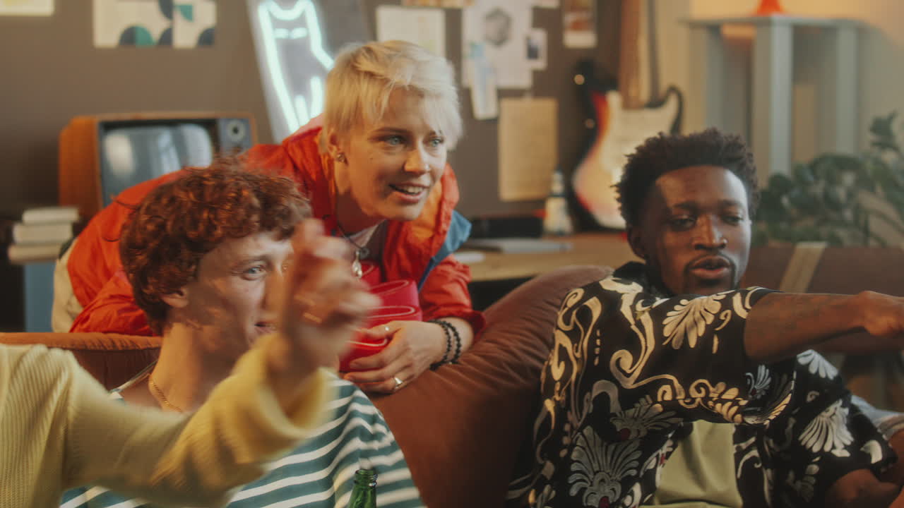 Cheerful Friends Having Beer with Snacks as Watching Sports Match at Home