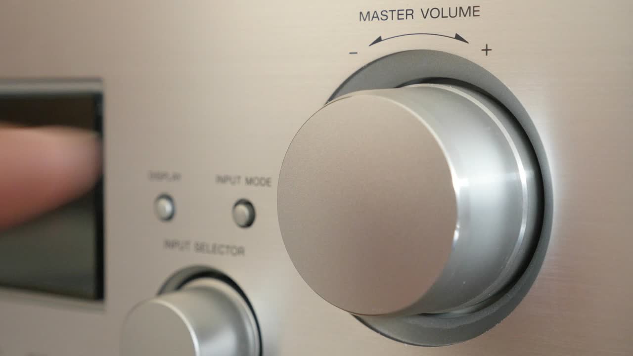 Turning wheel dial on silver amplifier on higher levels 4K 2160p UltraHD footage - high volume setting on modern power amp jog dial 4K 3840X2160 UHD video