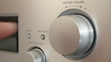 turning wheel dial on silver amplifier on higher levels 4k 2160p ultrahd footage - high volume setting on modern power amp jog dial 4k 3840x2160 uhd video