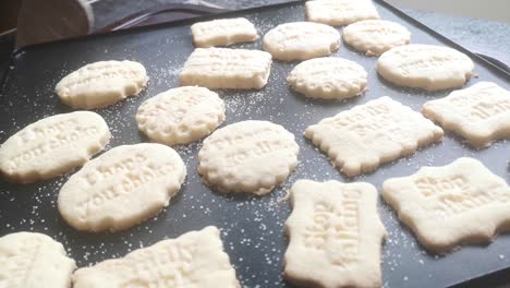 fresh baked homemade naughty offensive message shortbread cookies placed on wooden board