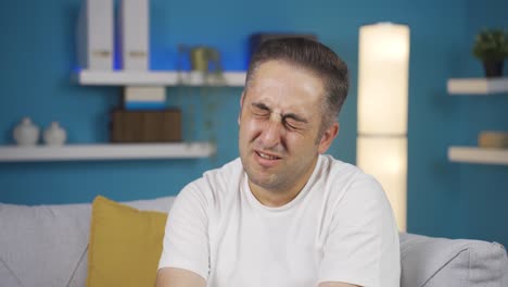 sad man is crying.