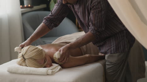 relaxing herbal compress massage
