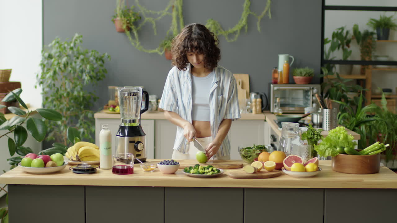 Woman Cutting Apple for Making Smoothie