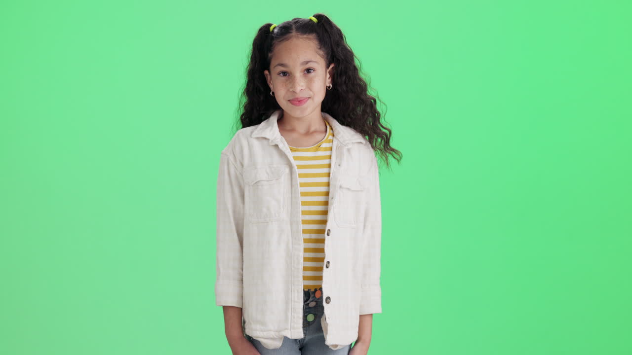 Girl pointing on green screen