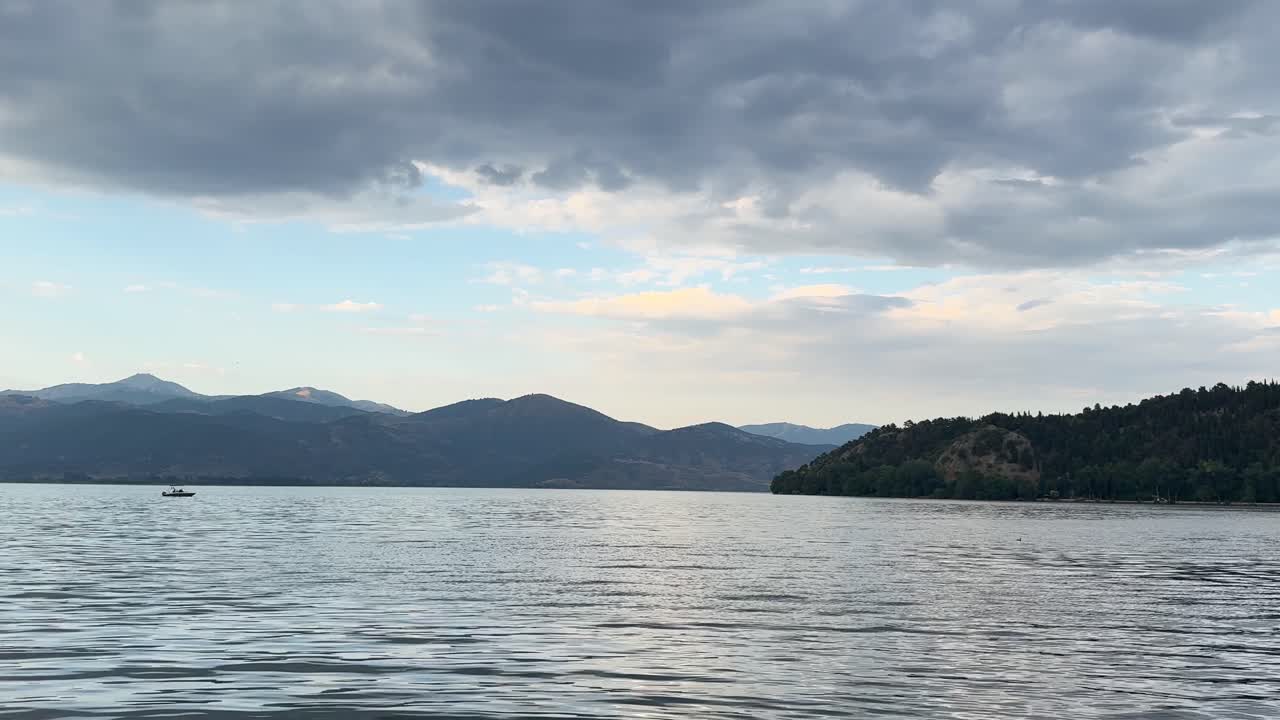 Kastoria lake Orestiada Greece nature calm water surface West Macedonia outdoor cloudy sky