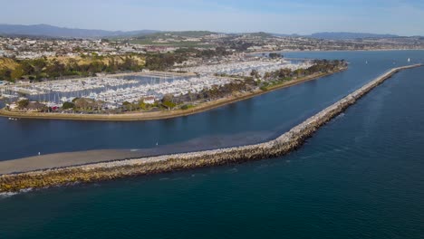 Incredible-panoramic-overview-of-jetty-protecting-boats-docked-in-harbor