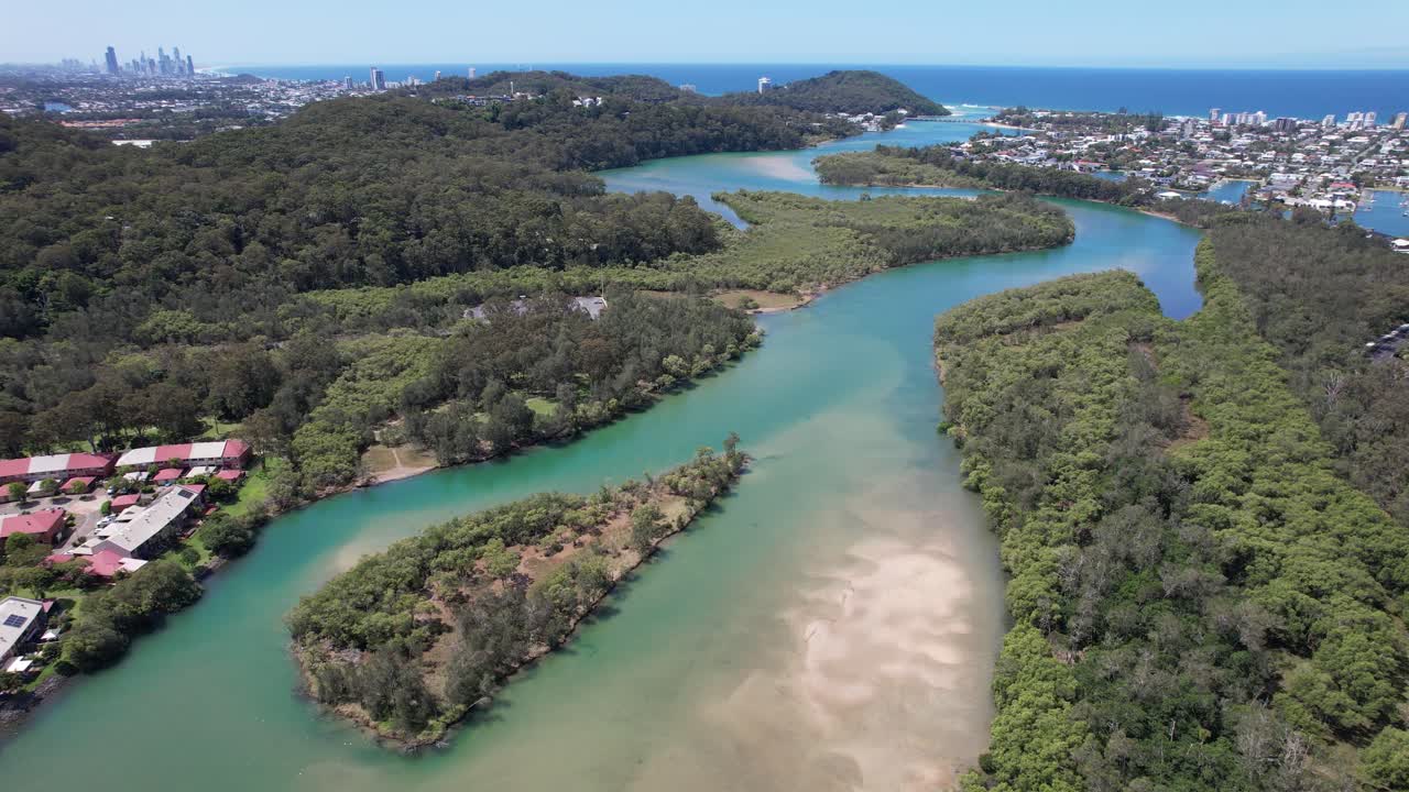 Tallebudgera Creek With Burleigh Headland In The Distance - Burleigh Heads, Queensland, Australia. - aerial shot
