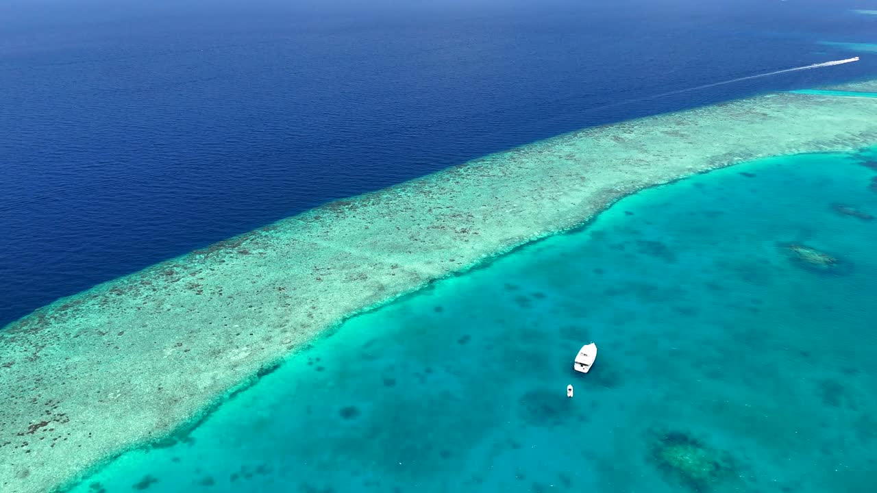 This clip was captured on our drone showing the beauty of the Maldives sea. Just look at them colours of the different blues and coral reefs.