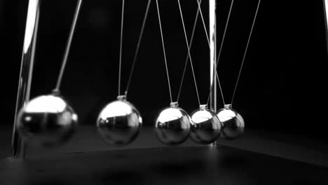 perpetual motion of newtons cradle close up