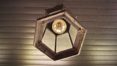 looking up on vintage light bulb on ceiling at barossa valley, adelaide, south australia