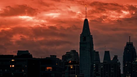 sunset over a cityscape with tall skyscrapers