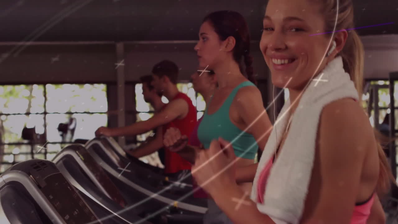 Exercising on treadmills, people with abstract light animation overlay in gym