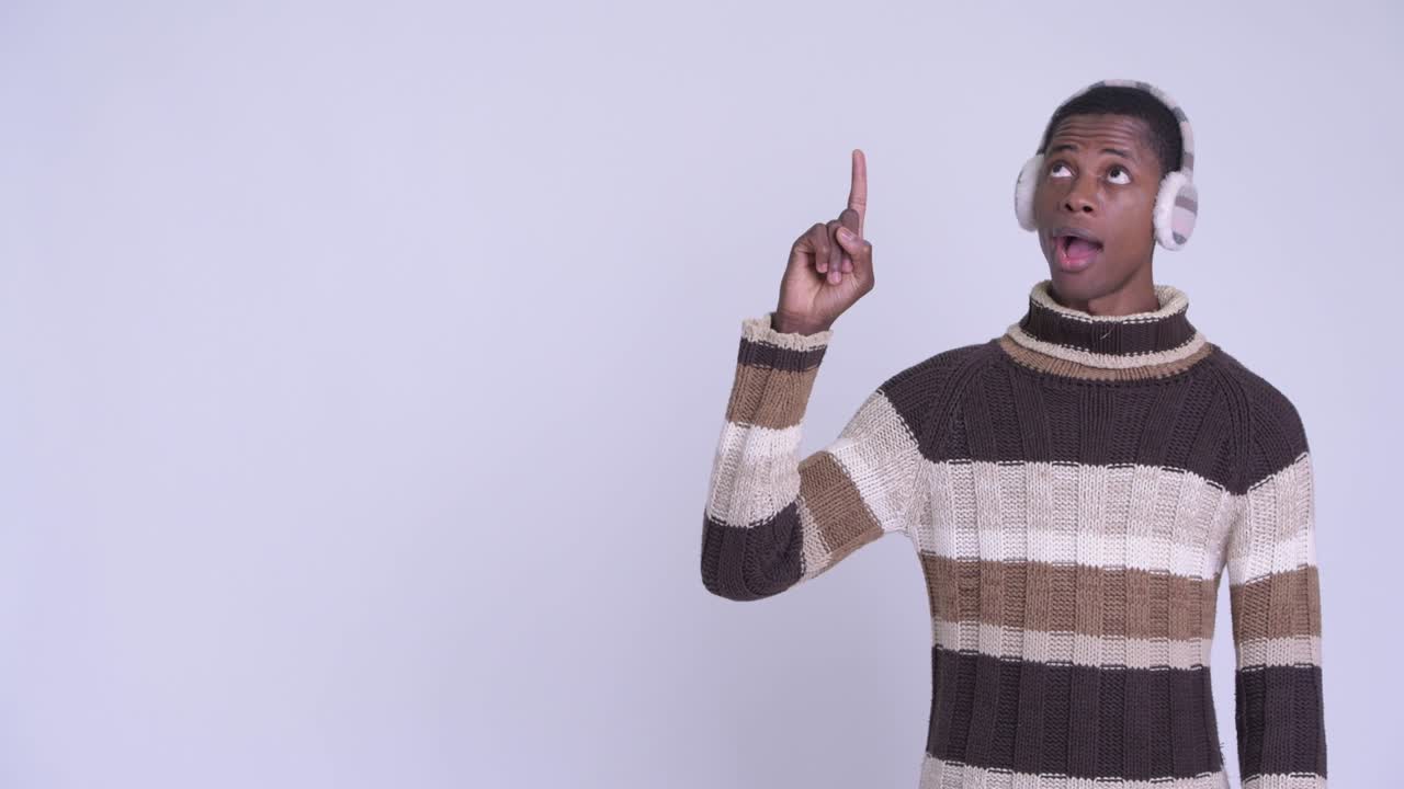 Young handsome African man ready for winter