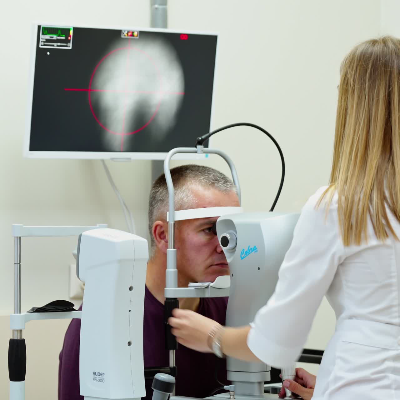 Ophthalmologist checks the eyes