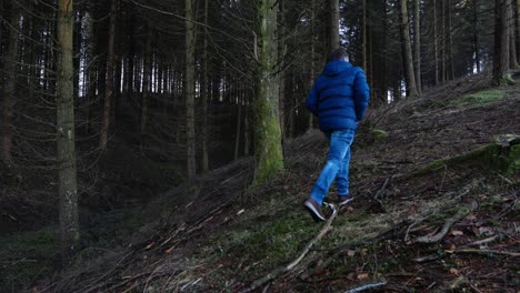 Man-walking-through-the-forest