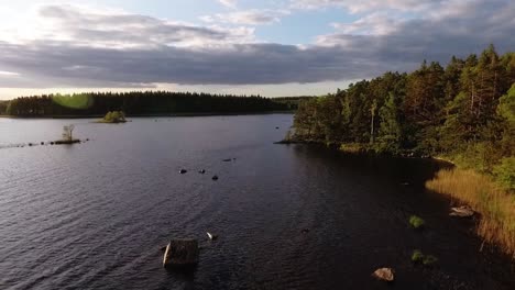 Aerial-of-a-lake-and-forest-in-Sweden