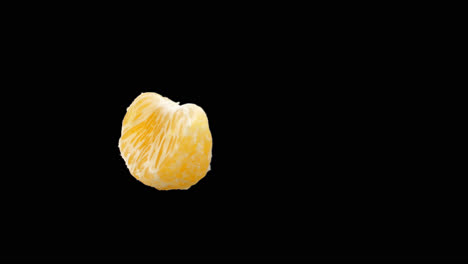 tangerine or clementine or orange fruit rotating with alpha channel, video in 4k