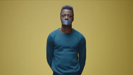 man with tape over mouth