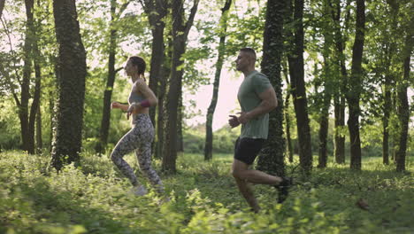 couple running in a forest