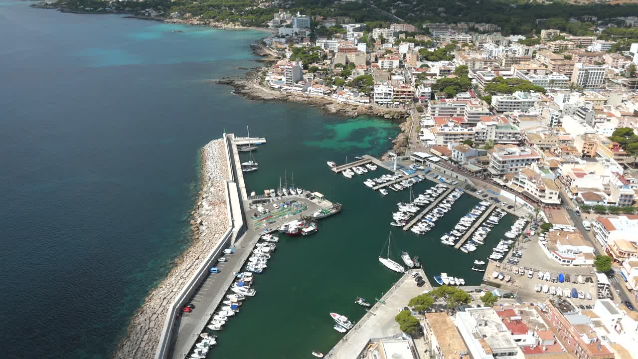 Boats docked at the marina in the harbor of Cala Ratjada in Majorca Spain, Aerial