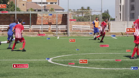 animation of social media icons over diverse male soccer players playing soccer on sports field