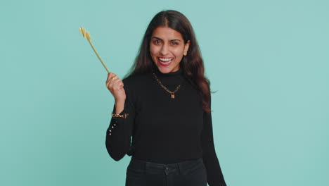 Magician-witch-indian-woman-gesturing-with-magic-wand-making-wish-come-true,-casting-magician-spell