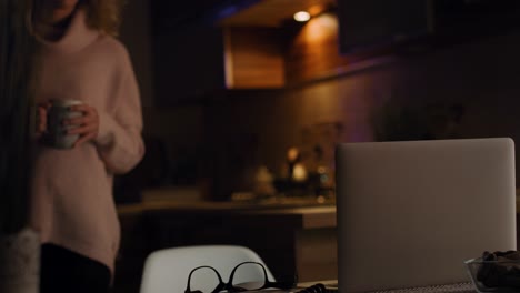 Video-of-woman-preparing-coffee-and-working-at-home-to-late