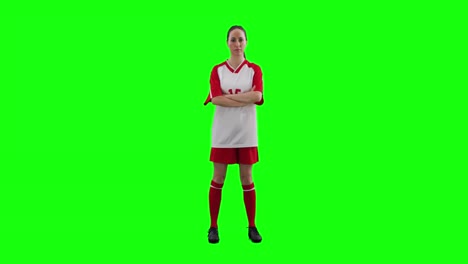 Video-of-portrait-of-caucasian-female-football-player-with-copy-space-on-green-screen