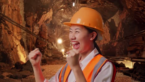 happy miner celebrating success in a mine tunnel