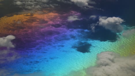 multicolor on planet surface from above between white clouds like in a fantasy dream over the atlantic ocean