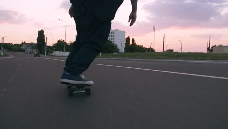 group of young people skateboarding on the road in the early morning, cinematic shot, slow motion