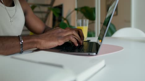 man working on laptop at home