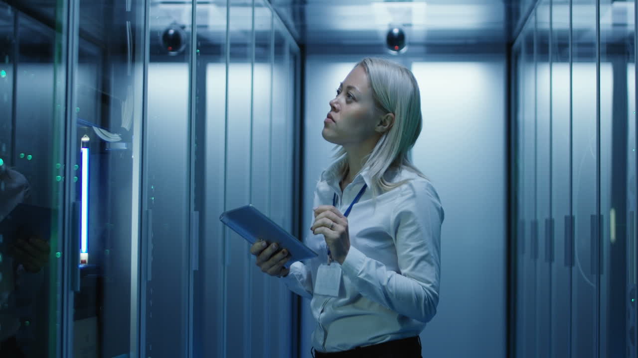 Woman IT technician working in a data center