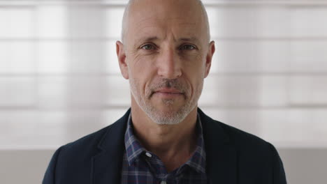 close up portrait of attractive mature businessman looking serious confident at camera professional caucasian male