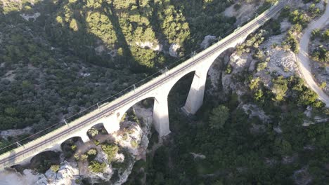 drone view of the bridge between two mountains, an old historical bridge