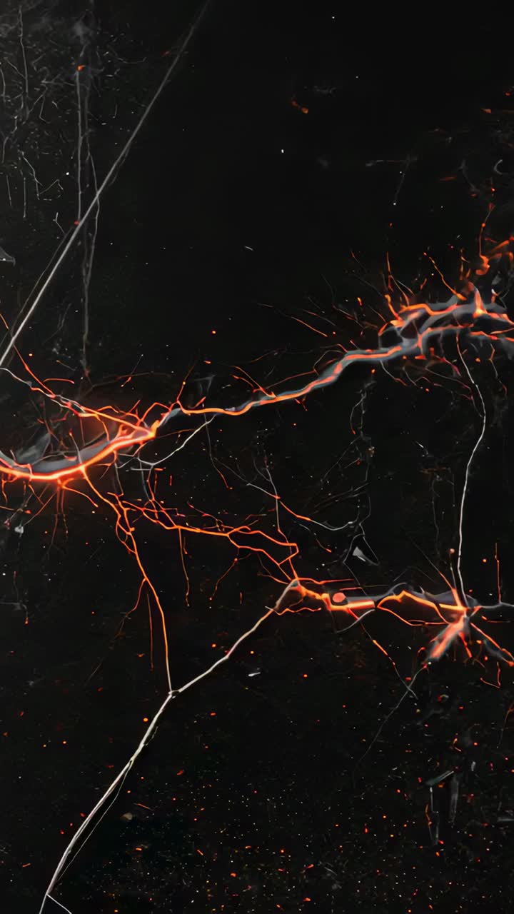Vertical video: Thin strands sparking, glowing veins pulsing on macro white cracks, sending embers