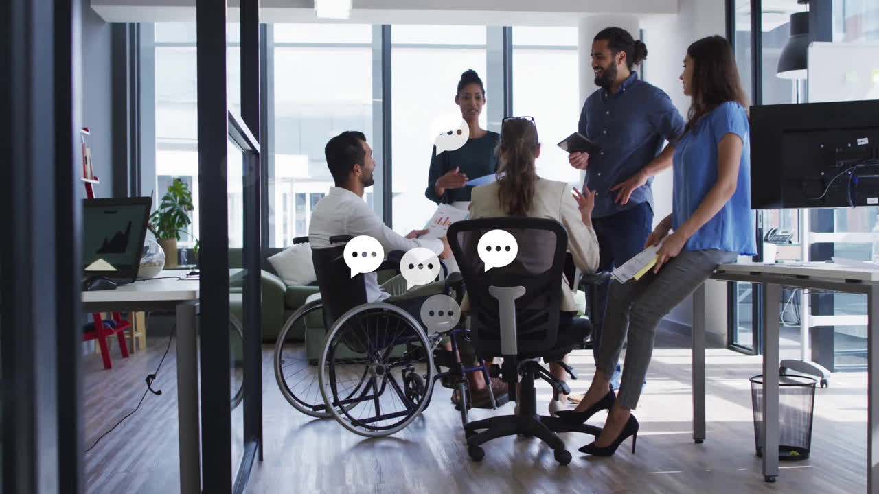 In office, diverse team having animated conversation with speech bubbles