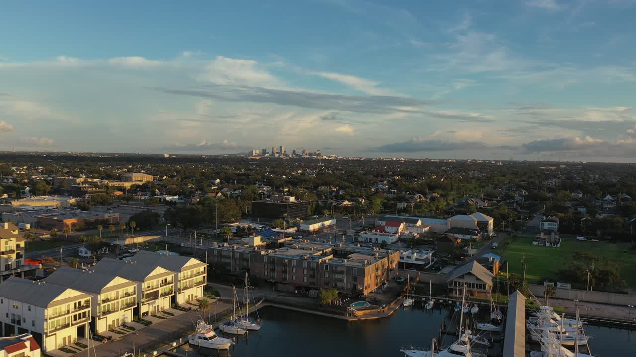 Pan view of New Orleans marina with the city of New Orleans in the backdrop as the sun sets