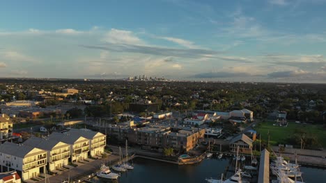 pan view of new orleans marina with the city of new orleans in the backdrop as the sun sets