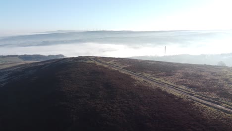 Cloudy-misty-sunrise-valley-aerial-moorland-hikers-hillside-muddy-path-Lancashire-slow-dolly-right